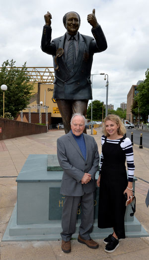 Sculptor James Butler alongside the statue