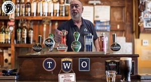 Greg enjoys pulling a pint on set.