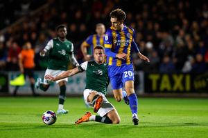 Tom Bayliss of Shrewsbury Town and Jordan Houghton of Plymouth Argyle (AMA)