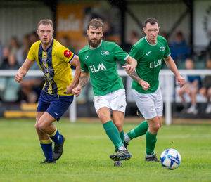 Brocton vs Uttoxeter Town Aug 30th 2025. Kenny Devoir side foots the ball away (Picture: Jim Wall)