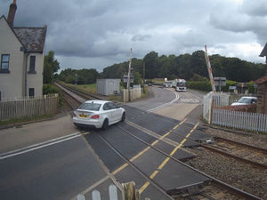 Supporting image for story: Video shows moment BMW driver charged over level crossing as barriers came down
