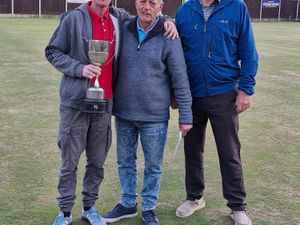 Another league title for Perry Evans, seen with officials Rich Jones and (right) Mike Caddick