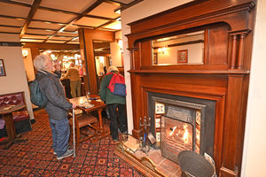 Patrons can enjoy a roaring fire as they sit with their beers