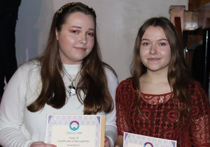 Amba Jackson and Emily Scowen with their certificates from Oldbury Wells School