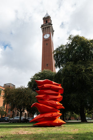 Red Stack by Shaikha Al Mazrou on Chancellor’s Court at the University of Birmingham, Edgbaston campus with Old Joe.