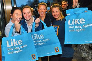 Shoppers and staff celebrate the opening of the store today
