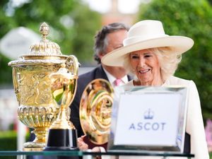 Supporting image for story: Queen presents winner’s trophy at Ascot after King George race