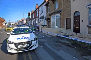 Police at the scene following the murder