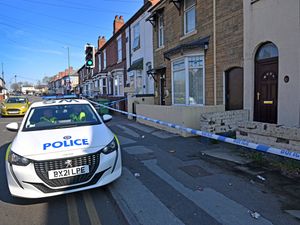 Police at the scene following the murder