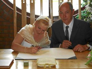 Cath and Darren sign the register for the second time.