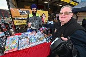  Stu 'Goldcrusher' Goldsmith at Crazy Clearance at Tipton where he picked up toys which will be donated to children at New Cross Hospital this Christmas. 
He is pictured with store boss Krishan Singh