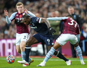 West Ham United's Michail Antonio (centre) battles with Aston Villa's Matt Targett (left)