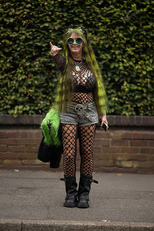 Music fan Rita Haney, AKA 'dimebagzhag', arrives to attend British rock band Black Sabbath's "Back to The Beginning" concert, Ozzy Osbourne's final ever gig as Black Sabbath's frontman at Villa Park in Birmingham, central England on July 5, 2025. Osbourne, who revealed in 2020 that he has Parkinson's disease, will join Tony Iommi, Geezer Butler and Bill Ward for the all-day "Back To The Beginning" show in Birmingham, central England, where the heavy metal giants formed in 1968. (Photo by Oli SCARFF / AFP) (Photo by OLI SCARFF/AFP via Getty Images)          