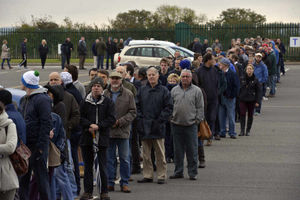 Shrewsbury Town fans queue at the Greenhous Meadow