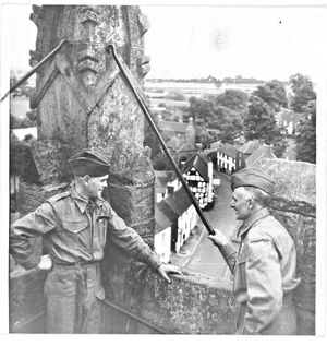 July 27, 1940: Two members of the Home Guard at St Mary's Church, Claverley, keeping watch over the countryside from the top of the church tower.