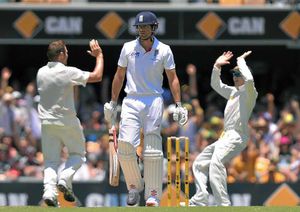 Australia's Ryan Harris (left) celebrates taking the wicket of England's Alastair Cook (centre)