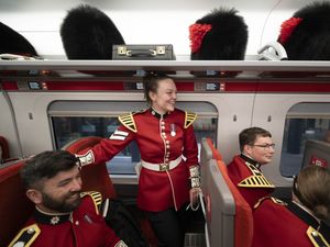 Supporting image for story: In Pictures: Bearskin caps in the luggage rack as Coldstream Guards return home