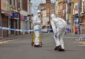 Forensic investigators outside Chicago's in Stourbridge High Street gathering evidence