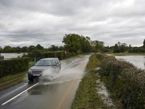 Supporting image for story: Three people rescued from vehicles as heavy rain causes floods