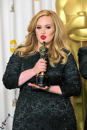 Adele holds her Oscar for best song Skyfall