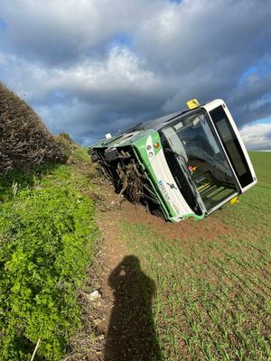 The Lakeside Coaches bus on its side near Ellesmere. Photo: SFRS
