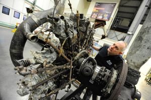 Aircraft technician John Warburton at work on the outside of the Dornier
