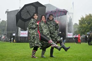 Dancing in the rain at Heal Festival: Cara Morrison from Shrewsbury with her girls Ellie and Lacey
