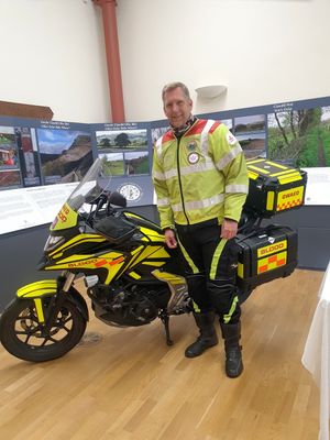 Steve Bufton Blood Bikes with bike at the presentation