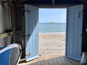 Supporting image for story: Tiny beach hut with stunning view and just a step away from the sand on market at £185k 