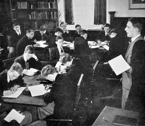  Laurence Le Quesne, right, teaching in the library at Shrewsbury School in 1953. 
