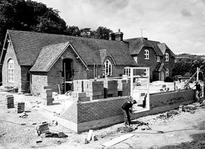 June 9, 1981. The caption reads: 'The old and the new, the shell of the former village school at Diddlebury, near Craven Arms, which has been completely gutted for refurbishing and to which a new classroom and lavatory block are now being added. The new complex is to be called The Corvedale School and when completed at the end of the year, will serve many more of the smaller villages of the area.'