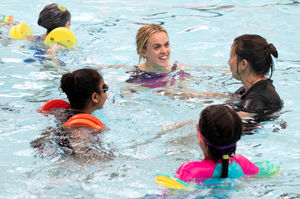 Swimmer Ellie Simmonds with children at Smethwick Swimming Centre. Photo: Chris Radburn/PA Wire