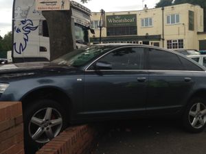 Supporting image for story: Crashes leave car on wall and street lighting knocked out