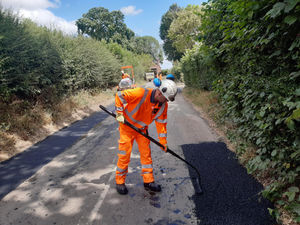 Daniel Wise rakes the road near Stapleton. Picture: LDRS