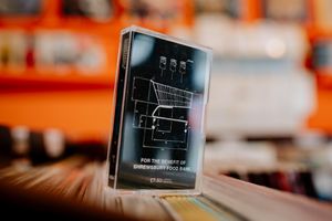 SHREWS COPYRIGHT SHROPSHIRE STAR JAMIE RICKETTS 08/07/2020 - James Townend from Shrewbsbury has created a mixtape with his friends to raise money for St Barnabes Food Bank. It features 21 artists. He is selling them at Left For Dear in Wyle Cop, Shrewsbury. In Picture L>R: James Townend, Dominic Craven (Artist) and Andy Haddon (Left For Dead Owner)..