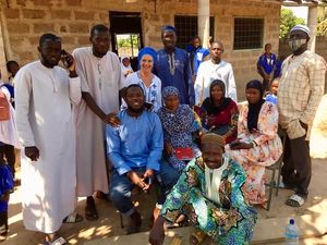 ‘Goal for The Gambia’ founder, Sandy Sanyang with school staff and village elders.