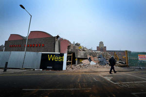 Debris spilled into the road when the wall came down