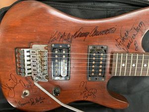 The Whitesnake guitar signed by band members