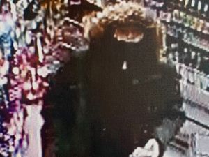 Supporting image for story: Police release CCTV still after woman armed with handgun threatened staff in Shrewsbury shop raid