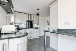 There's a modern kitchen/breakfast room with utility