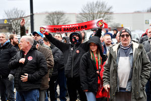 Walsall fans protest about the board at Banks's Stadium.