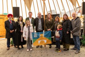Amelia and her family with the new flag for Telford. Picture: Telford & Wrekin Council