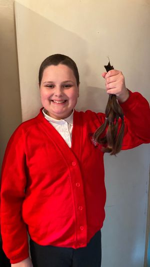 Katie Williams with her hair after she had it shaved off in memory of her dad