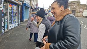Charmaine Grace and Nadine Hill lead the dancing through the town