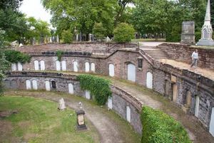 Warstone Lane Cemetery Catacombs or Brookfield Cemetery has a secret catacomb. It was established in 1848 and burials took place until 1982. It looks like a semicircle just like a Roman amphitheatre. | Wikimedia Commons
