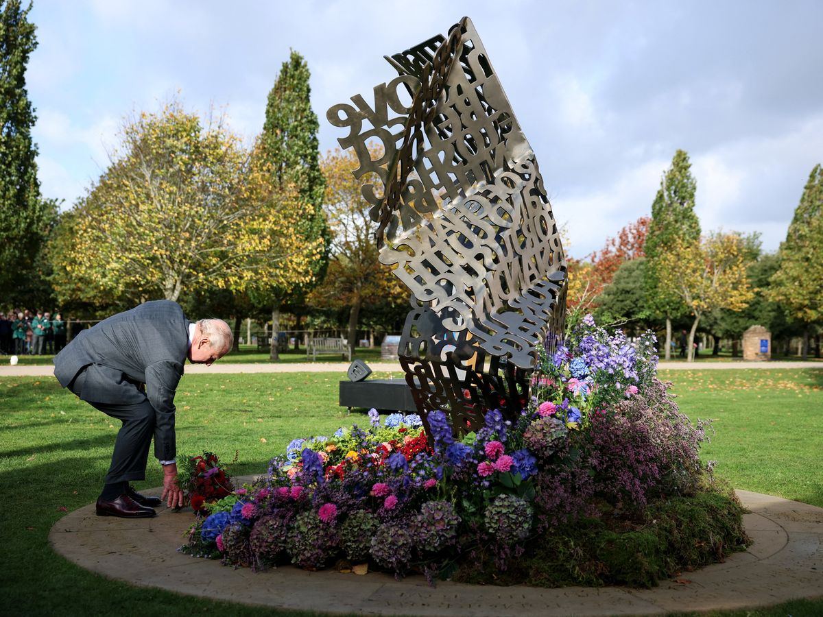 Charles lays flowers at first national LGBT armed forces memorial