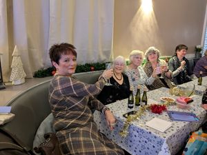 Hayes Green president Val Lomas raises a Christmas toast.