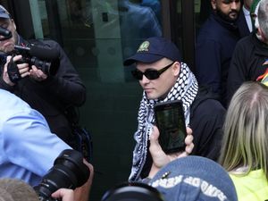 Supporting image for story: Kneecap rapper faces month-long wait over whether terror charge is thrown out