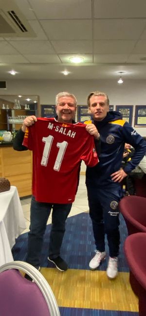 Jason Cummings and dad David with Mo Salah's shirt after the FA Cup tie against Liverpool