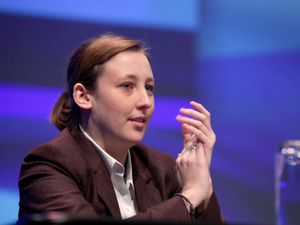 Mhairi Black clapping while seated